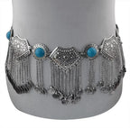 Boho silver coin belt with turquoise accents and dangling chains on mannequin waist