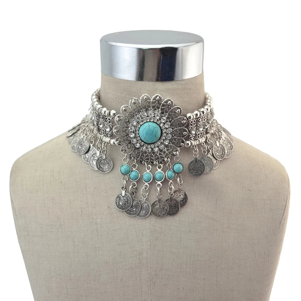 Boho silver choker necklace with turquoise stones and coin charms on mannequin bust