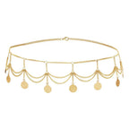 Gold coin chain belt with layered drape design and dangling charms on white background