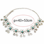 Bohemian silver necklace with turquoise flower accents and round coin charms, adjustable length