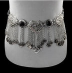 Ornate silver belly dance belt with coins and chain fringe on mannequin waist
