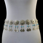 Silver coin belly dance belt with blue bead accents on mannequin waist