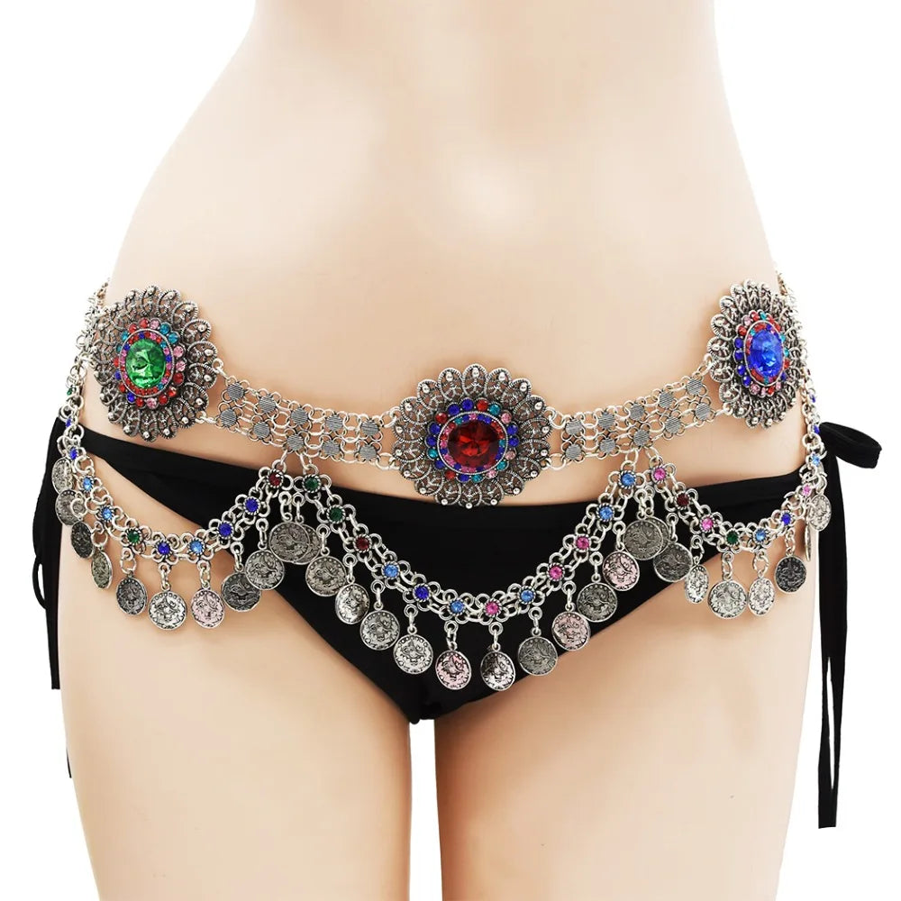 Belly dancer coin belt with colorful gemstones and dangling silver coins on a black bikini