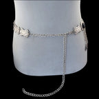 Silver waist chain belt with ornate metal links on mannequin, adjustable fashion accessory