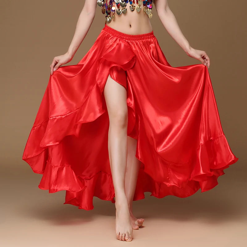 Woman modeling a flowing red satin ruffle dance skirt with high slit