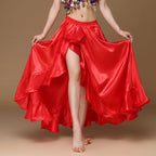 Woman modeling a flowing red satin ruffle dance skirt with high slit