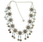 Boho silver coin necklace with floral medallions and turquoise bead accents