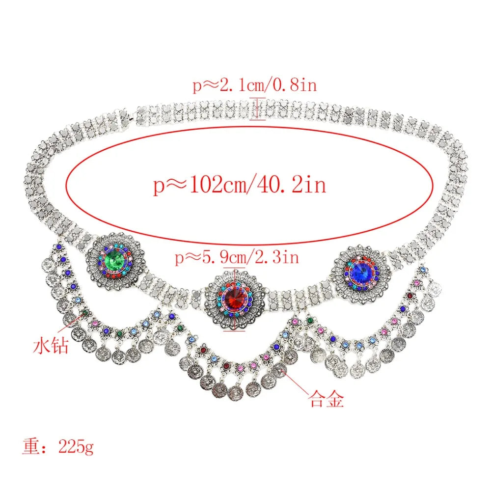 Decorative silver waist chain belt with colored rhinestones and hanging coins, labeled measurements.