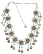 Boho statement necklace with silver sunflowers, turquoise beads, and coin charms