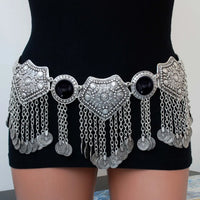 Bohemian silver coin chain waist belt with black accents worn on black dress