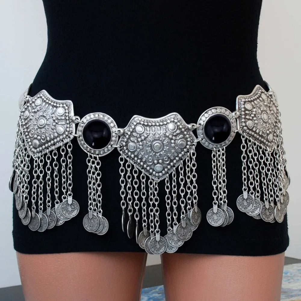 Bohemian silver coin chain waist belt with black accents worn on black dress