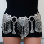 Bohemian silver coin chain waist belt with black accents worn on black dress