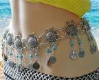 Bohemian silver coin waist chain with turquoise beads worn at the beach
