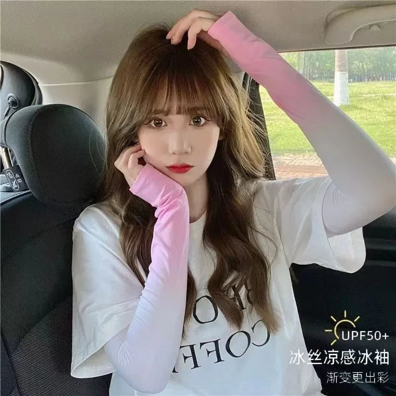 Woman in car wearing UPF 50+ pink gradient sun protection sleeves and white t-shirt