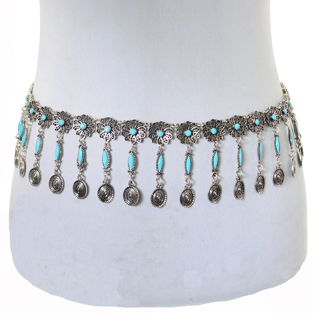 Boho silver waist chain belt with turquoise stones and dangling medallions on mannequin