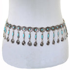 Boho silver waist chain belt with turquoise stones and dangling medallions on mannequin