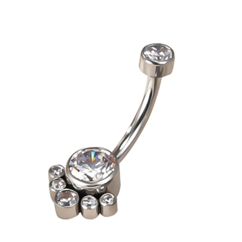 Silver belly button ring with clear gemstones in a paw design on white background