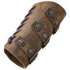 Brown faux leather wrist cuff with decorative silver conchos and lace-up closure.