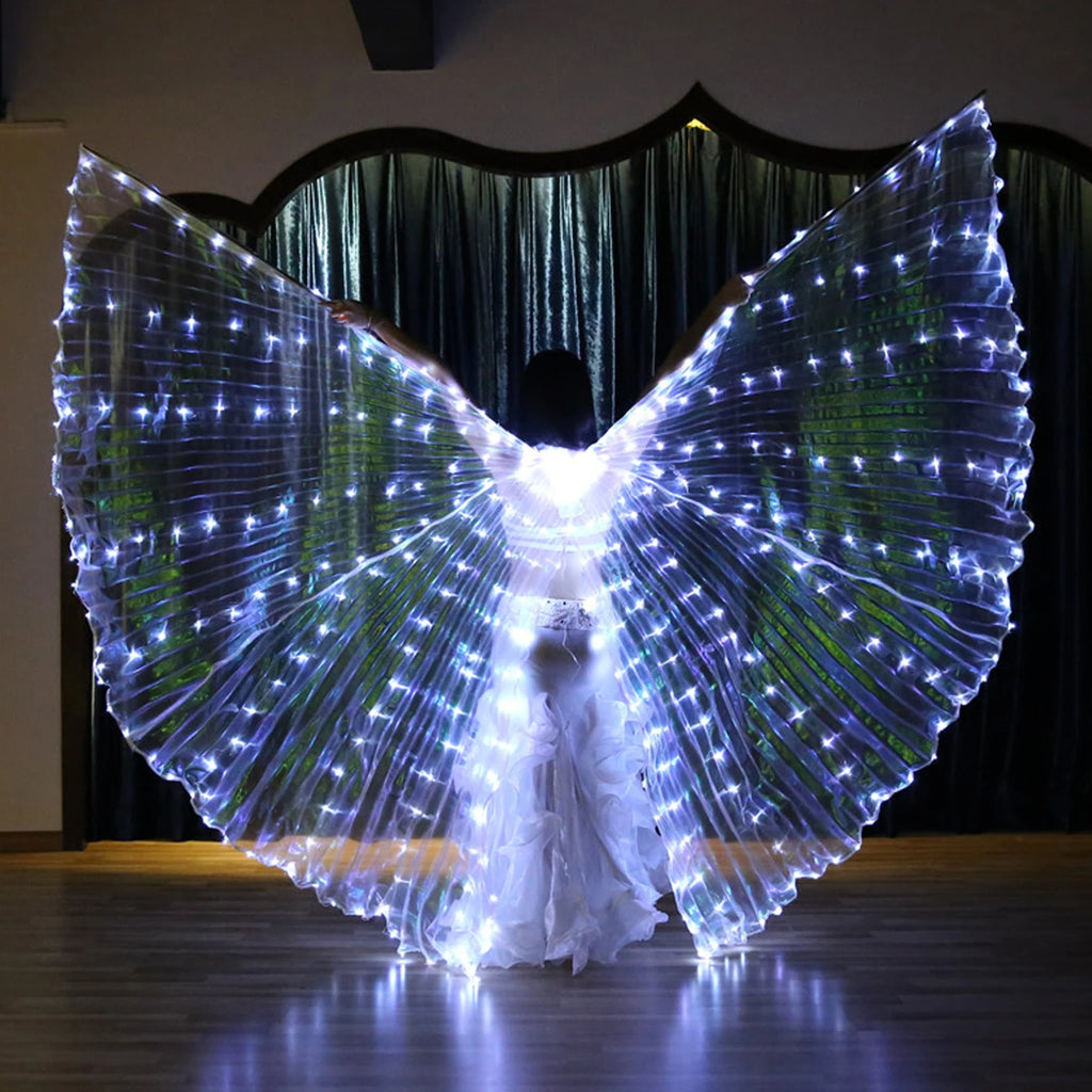 Person wearing large LED light up wings costume, illuminated on indoor stage