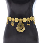 Gold coin chain waist belt with ornate medallion and dangle accents on mannequin torso