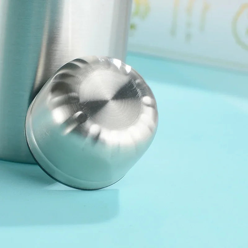 Stainless steel insulated bottle base with cap on a blue background