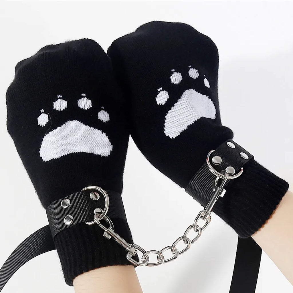 Black paw print mittens with wrist straps connected by a metal chain, novelty accessory