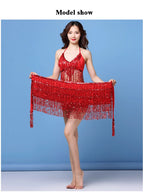 Woman modeling a red fringe sequin dance dress against a blue background