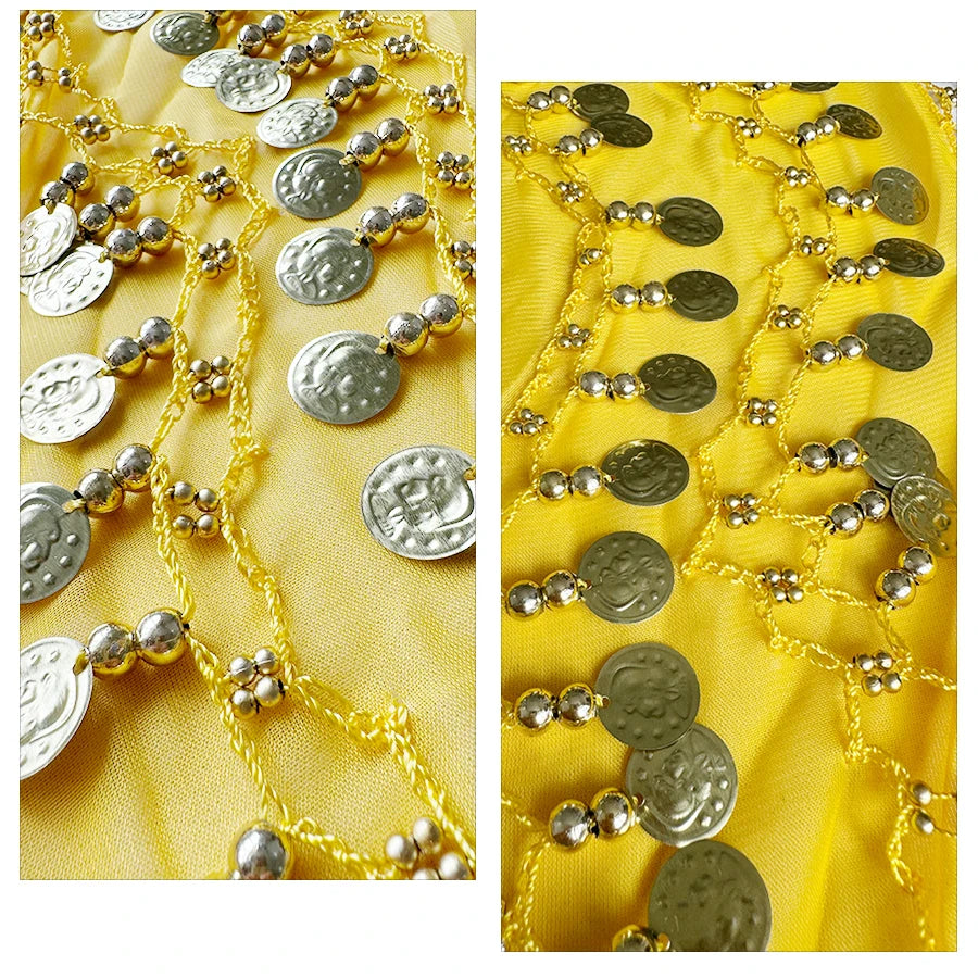 Gold coin and bead chain accents on yellow fabric, decorative textile detail