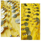 Gold coin and bead chain accents on yellow fabric, decorative textile detail
