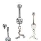 Silver belly button ring with clear crystal gems in geometric design, close-up views