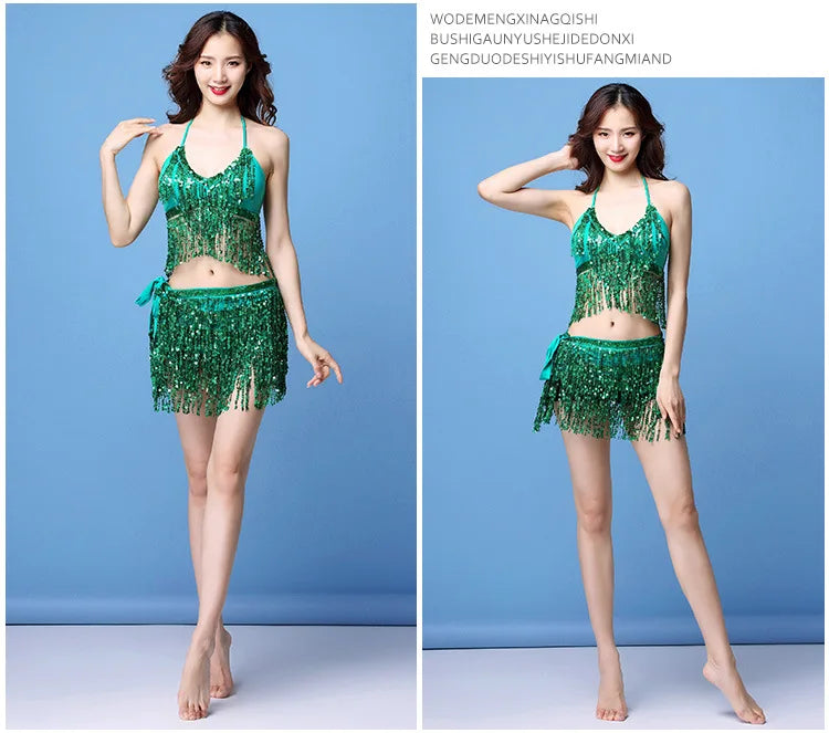 Woman modeling green sequin halter dance outfit with fringe skirt against blue background