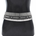 Silver boho coin chain waist belt with ornate details on mannequin torso