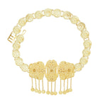 Gold coin belt with intricate floral motifs and dangling coin charms, ornate fashion accessory