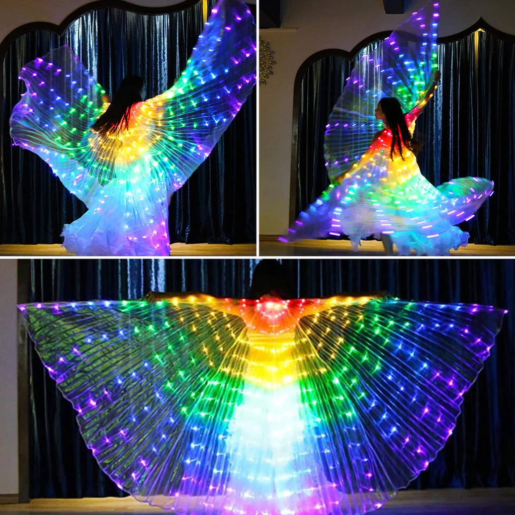 Person dancing with LED light up wings in rainbow colors indoors