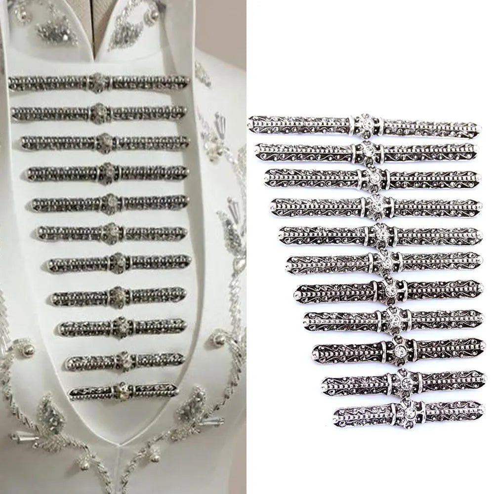Set of ornate silver frog buttons displayed on white fabric and separately on a white background