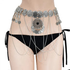 Boho silver coin chain belt with intricate medallion details, styled over black bikini bottoms