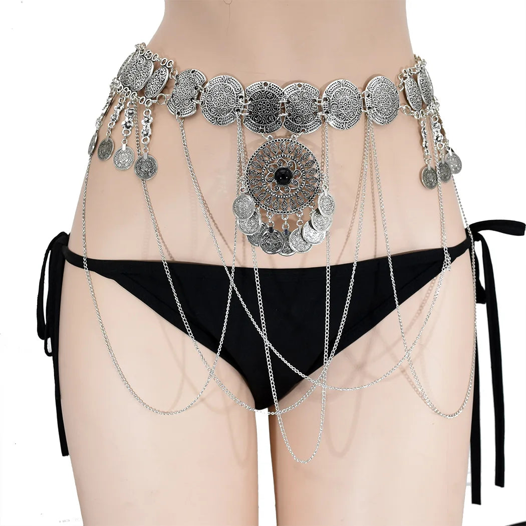 Boho silver coin chain belt with intricate medallion details, styled over black bikini bottoms