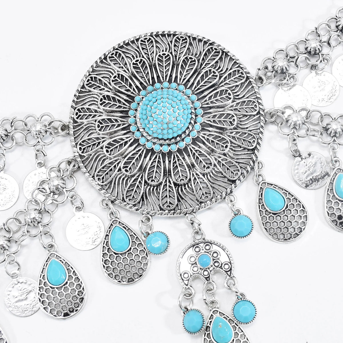 Boho statement necklace with intricate silver filigree and turquoise accents