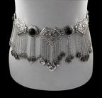 Boho silver coin belly dance belt with black gemstone accents and intricate metalwork, displayed on a mannequin.