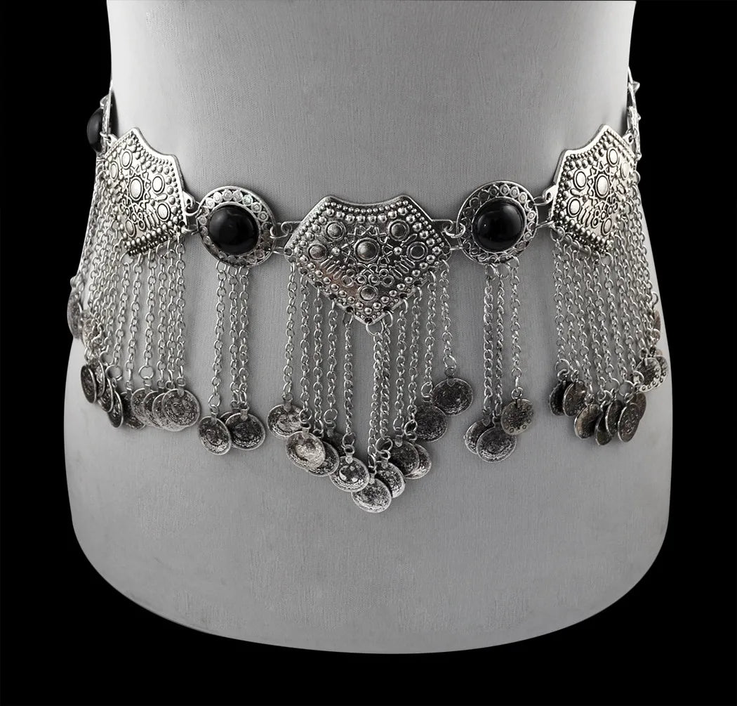 Boho silver coin belly dance belt with black gemstone accents and intricate metalwork, displayed on a mannequin.