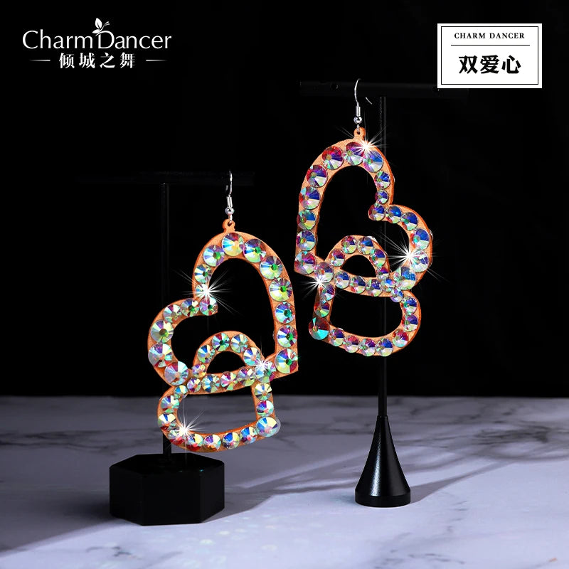Sparkling double heart dangle earrings with colorful crystals on black display stands