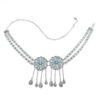 Silver floral chain belt with turquoise accents and decorative dangling pendants