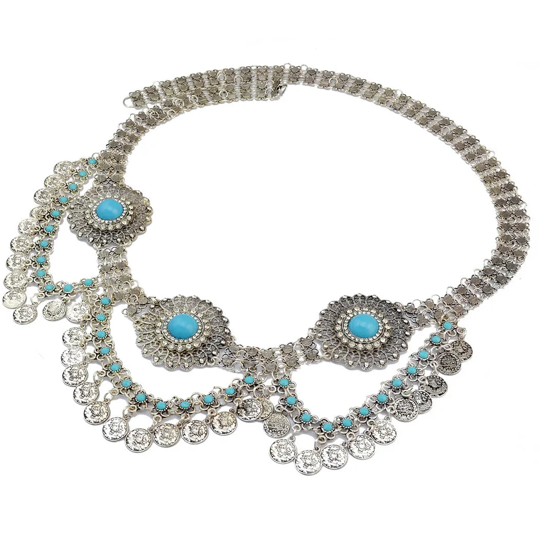 Bohemian silver statement necklace with turquoise stones and coin charms on white background