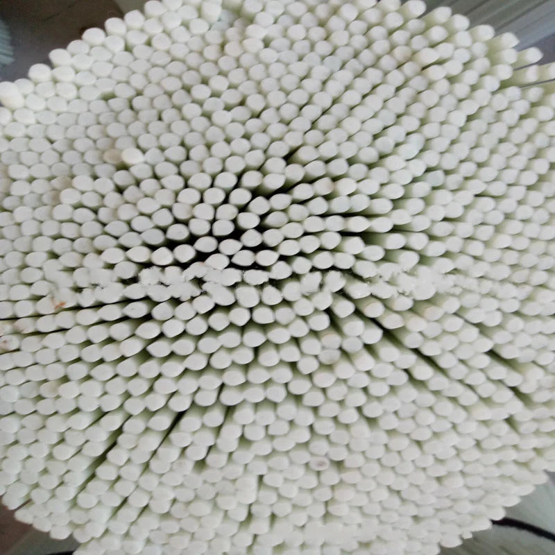 Close-up of a bundle of white cotton swabs arranged in a circular pattern