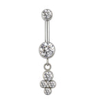 Silver belly button ring with clear cubic zirconia gems and dangle cluster design on white background.