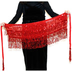 Red sequin fringe belly dance hip scarf held by a person in a black dress