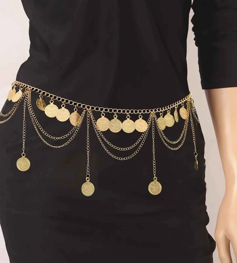 Gold coin chain belt with layered chains draped on a black dress, statement fashion accessory.