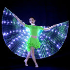 Child in green dance costume with illuminated LED butterfly wings performing on stage
