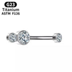 G23 titanium curved barbell piercing with three clear gemstones, ASTM F136 certified.