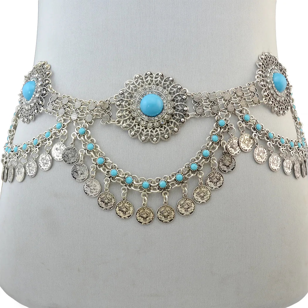 Silver waist chain belt with turquoise stones and dangling coin charms, displayed on mannequin.
